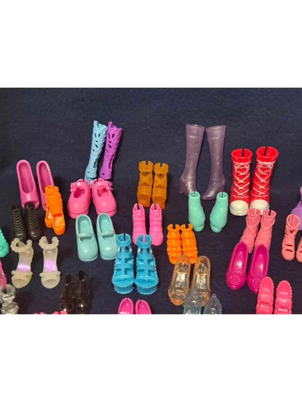 46 Matching pair of small dolls, Barbies, and Ken shoes